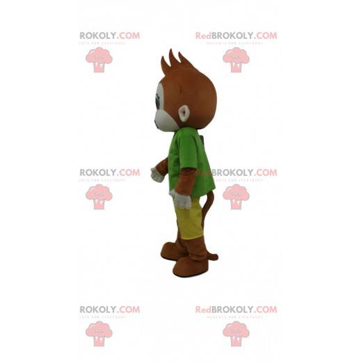 Brun abe maskot klædt i et farverigt tøj - Redbrokoly.com