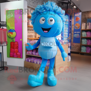 Blue Candy mascot costume character dressed with a Jeggings and Tote bags
