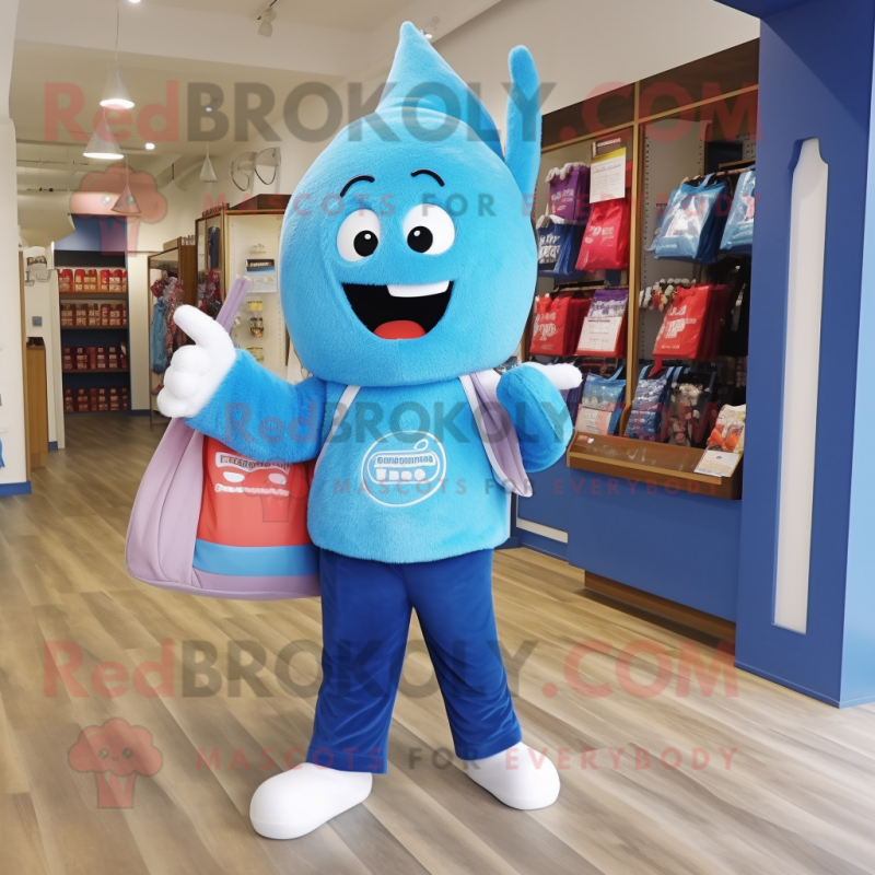 Blue Candy mascot costume character dressed with a Jeggings and Tote bags