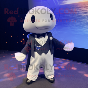 Navy Beluga Whale mascot costume character dressed with a Tuxedo and Suspenders