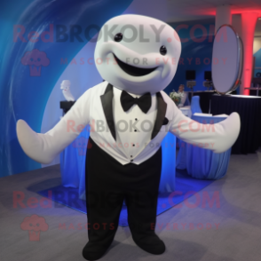 Navy Beluga Whale mascot costume character dressed with a Tuxedo and Suspenders