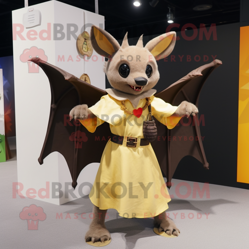 Gold Fruit Bat mascot costume character dressed with a Wrap Skirt and Suspenders Gold Fruit Bat mascot costume character dressed with a Wrap Skirt and Suspenders