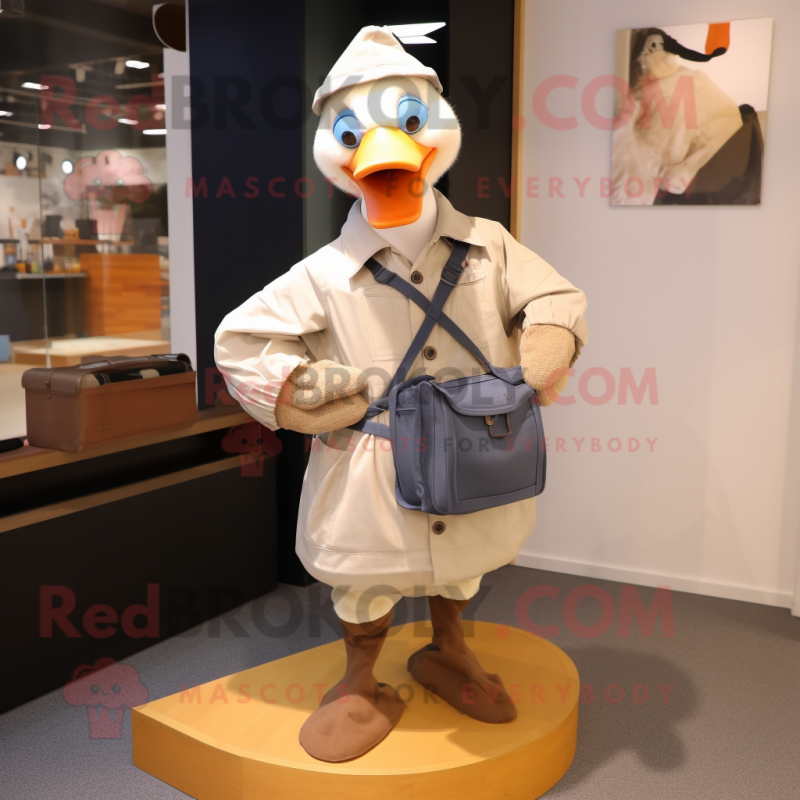 nan Goose mascot costume character dressed with a Dungarees and Messenger bags nan Goose mascot costume character dressed with a Dungarees and Messenger bags