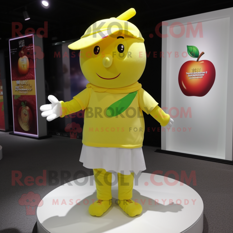 Yellow Apple mascot costume character dressed with a Polo Tee and Shawls Yellow Apple mascot costume character dressed with a Polo Tee and Shawls