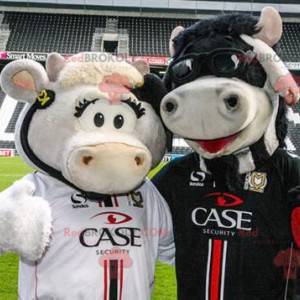 2 cow mascots, one white and one black - Redbrokoly.com