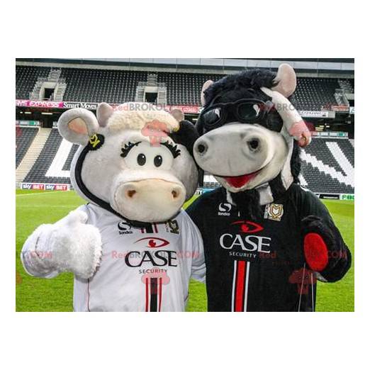 2 mascottes de vaches une blanche et une noire - Redbrokoly.com