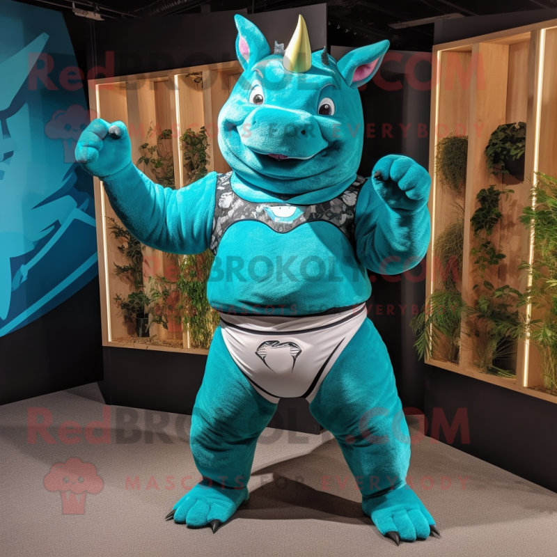 Turquoise Rhinoceros mascot costume character dressed with a Bikini and Belts