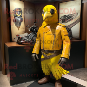 Yellow Blackbird mascot costume character dressed with a Moto Jacket and Clutch bags