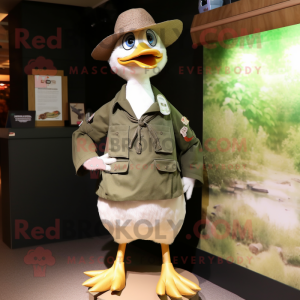 Olive Geese mascot costume character dressed with a Poplin Shirt and Hat pins