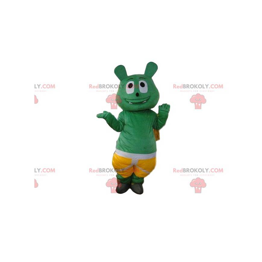 Mascota monstruo verde con pantalones cortos, traje de criatura