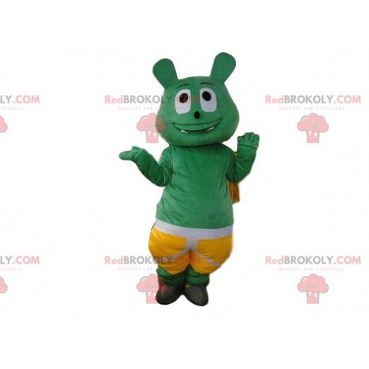 Green monster mascot with shorts, green creature costume -
