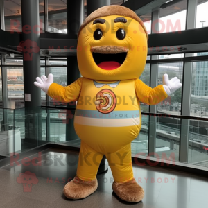 Gold Donut mascot costume character dressed with a Rash Guard and Suspenders