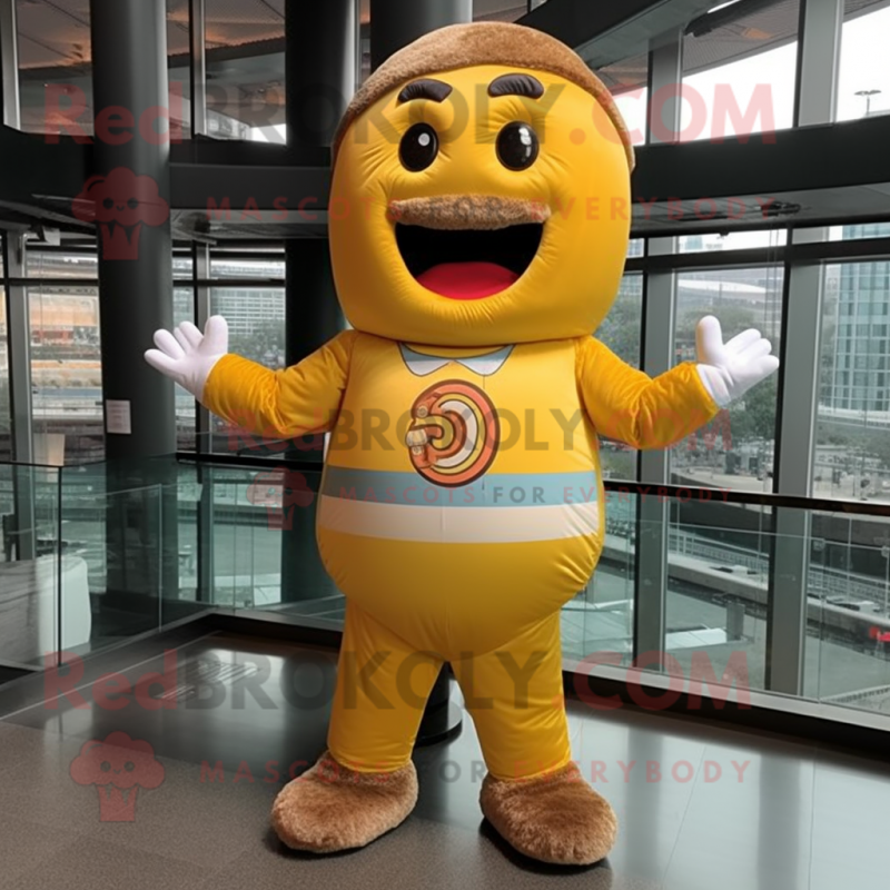 Gold Donut mascot costume character dressed with a Rash Guard and Suspenders