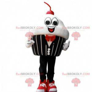 Mascot slagroomtaart met een kers, elegant kostuum -