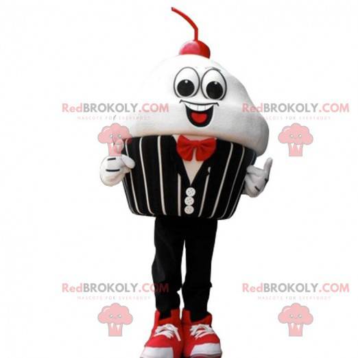Mascot slagroomtaart met een kers, elegant kostuum -