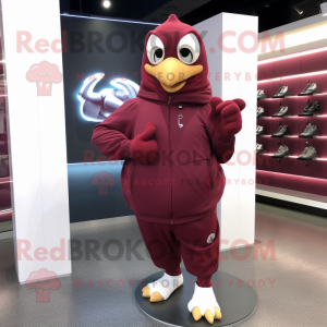 Maroon Dove mascot costume character dressed with a Hoodie and Rings