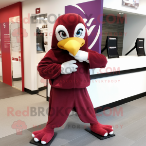 Maroon Dove mascot costume character dressed with a Hoodie and Rings