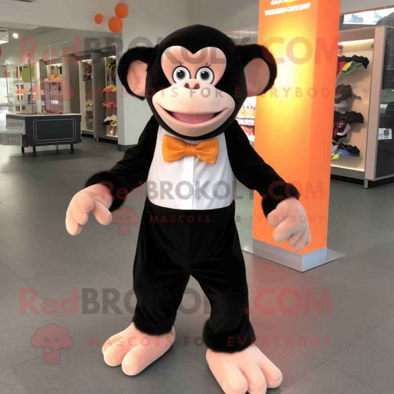 Peach Chimpanzee mascot costume character dressed with a Long Sleeve Tee and Bow ties Peach Chimpanzee mascot costume character dressed with a Long Sleeve Tee and Bow ties