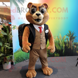 Tan Jaguarundi mascot costume character dressed with a Suit Jacket and Backpacks