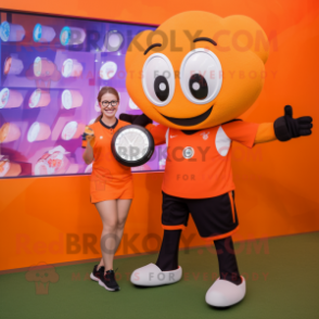 Orange Soccer Ball mascot costume character dressed with a Blouse and Smartwatches