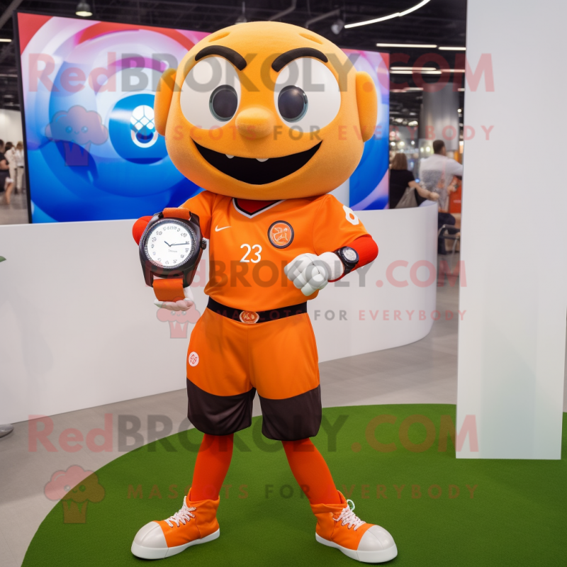 Orange Soccer Ball mascot costume character dressed with a Blouse and Smartwatches Orange Soccer Ball mascot costume character dressed with a Blouse and Smartwatches