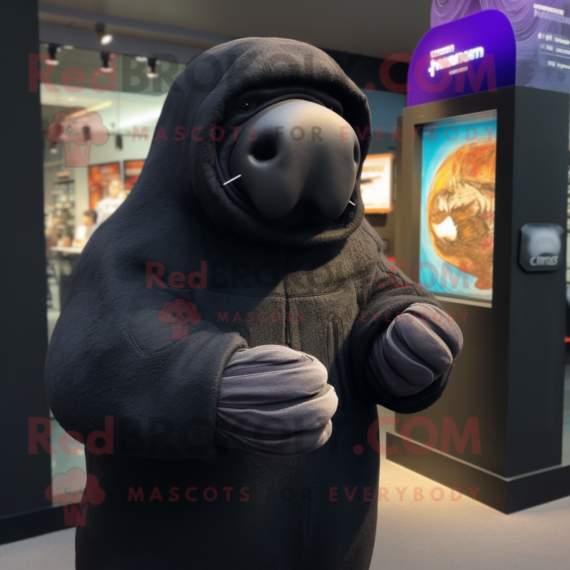 Black Walrus mascot costume character dressed with a Hoodie and Mittens Black Walrus mascot costume character dressed with a Hoodie and Mittens