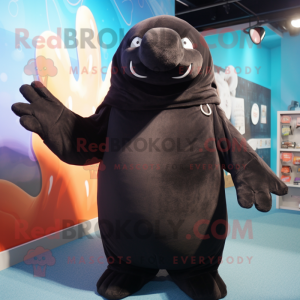 Black Walrus mascot costume character dressed with a Hoodie and Mittens