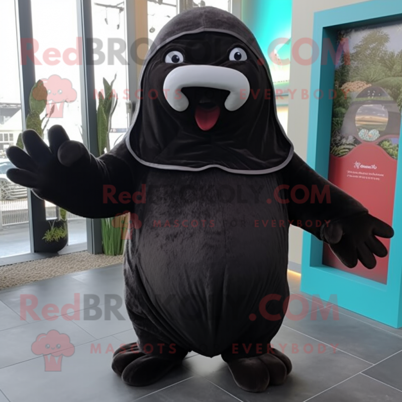 Black Walrus mascot costume character dressed with a Hoodie and Mittens Black Walrus mascot costume character dressed with a Hoodie and Mittens