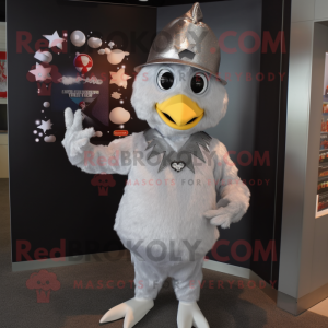 Silver Chicken mascot costume character dressed with a Graphic Tee and Hat pins