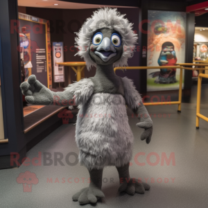 Gray Emu mascot costume character dressed with a Flare Jeans and Mittens