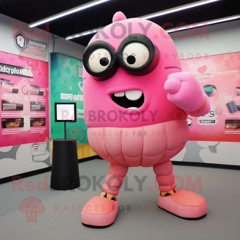 Pink Grenade mascot costume character dressed with a Sweater and Eyeglasses