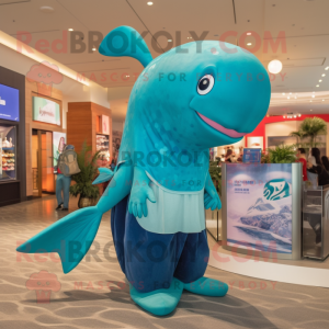 Teal Blue Whale mascot costume character dressed with a Graphic Tee and Brooches