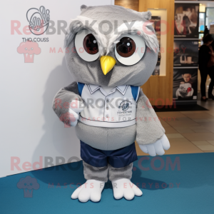 Silver Owl mascot costume character dressed with a Oxford Shirt and Shoe laces
