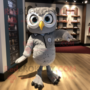 Silver Owl mascot costume character dressed with a Oxford Shirt and Shoe laces