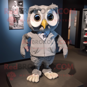 Silver Owl mascot costume character dressed with a Oxford Shirt and Shoe laces