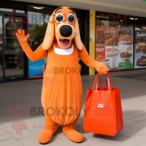 Orange Hot Dogs mascot costume character dressed with a Maxi Dress and Tote bags