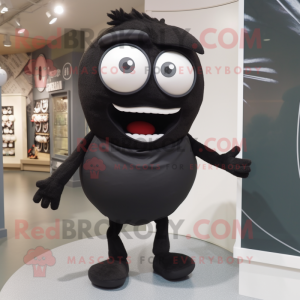 Black Cyclops mascot costume character dressed with a Poplin Shirt and Shoe laces