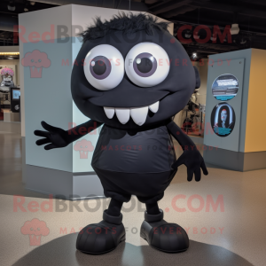 Black Cyclops mascot costume character dressed with a Poplin Shirt and Shoe laces