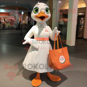 Peach Gull mascot costume character dressed with a Shift Dress and Tote bags