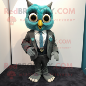 Teal Owl mascot costume character dressed with a Suit and Pocket squares