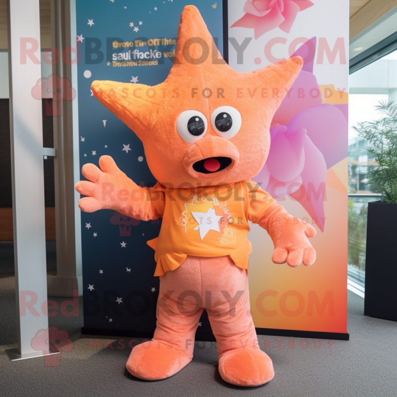 Peach Starfish mascot costume character dressed with a T-Shirt and Scarves