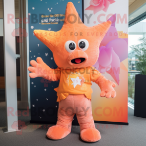 Peach Starfish mascot costume character dressed with a T-Shirt and Scarves