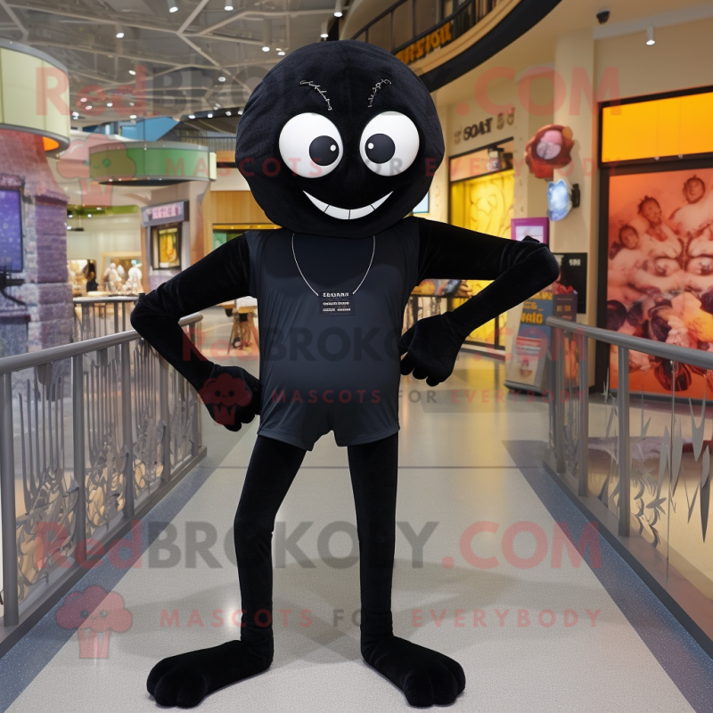 Black Spider mascot costume character dressed with a Rash Guard and Shoe laces Black Spider mascot costume character dressed with a Rash Guard and Shoe laces