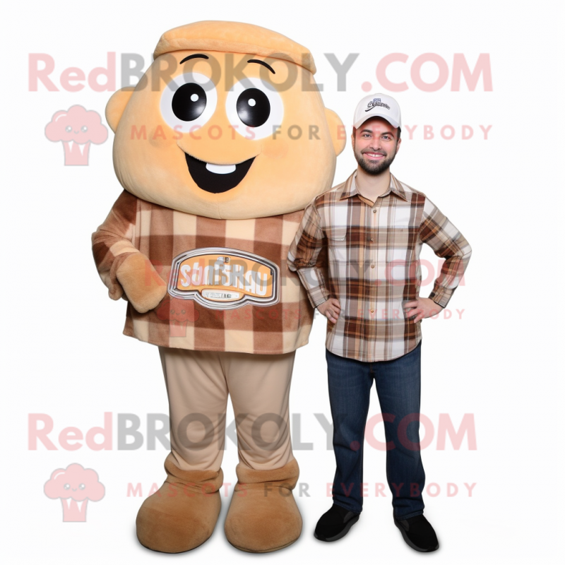 Tan Apricot mascot costume character dressed with a Flannel Shirt and Shoe laces Tan Apricot mascot costume character dressed with a Flannel Shirt and Shoe laces