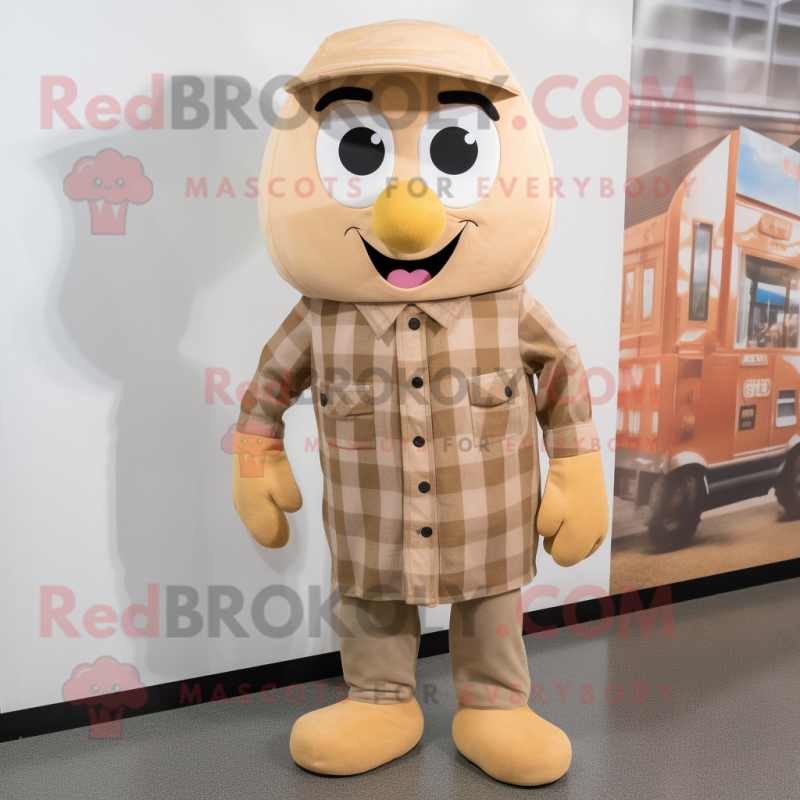 Tan Apricot mascot costume character dressed with a Flannel Shirt and Shoe laces Tan Apricot mascot costume character dressed with a Flannel Shirt and Shoe laces
