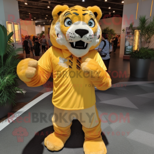 Yellow Saber-Toothed Tiger mascot costume character dressed with a Button-Up Shirt and Shoe laces