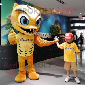 Gold Barracuda mascot costume character dressed with a Graphic Tee and Watches