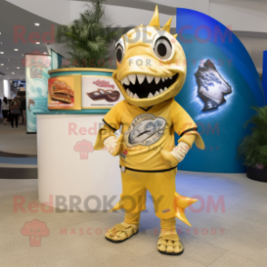 Gold Barracuda mascot costume character dressed with a Graphic Tee and Watches