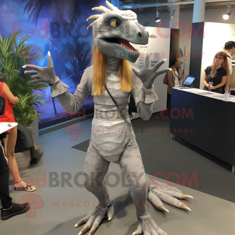 Silver Deinonychus mascot costume character dressed with a Romper and Hair clips Silver Deinonychus mascot costume character dressed with a Romper and Hair clips