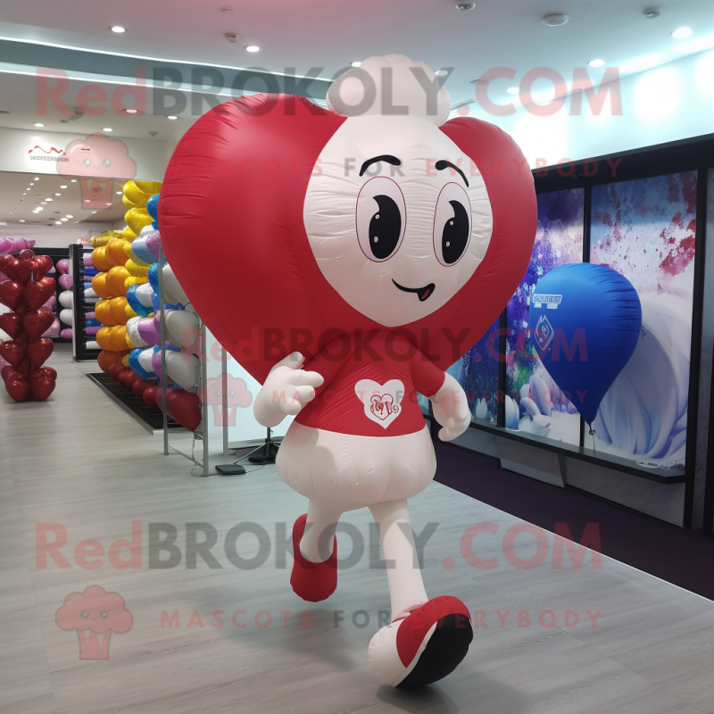 nan Heart Shaped Balloons mascot costume character dressed with a Running Shorts and Backpacks nan Heart Shaped Balloons mascot costume character dressed with a Running Shorts and Backpacks